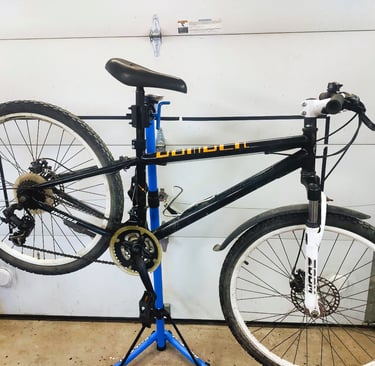 a bicycle that is sitting on a stand