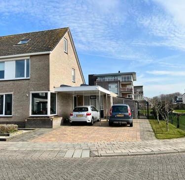a house with a car parked in front of it