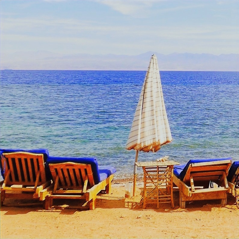 Relaxing in front of the sea on our chaise lounge