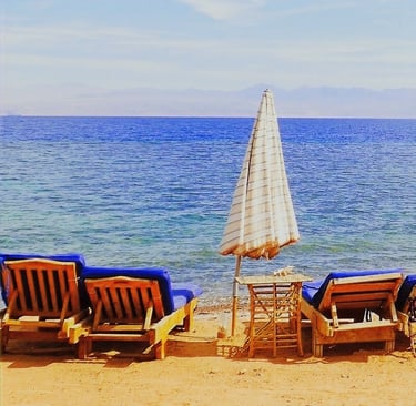 Relaxing in front of the sea on our chaise lounge
