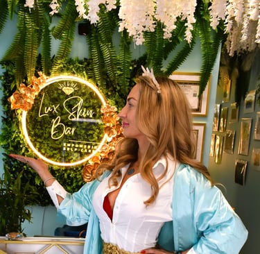 a woman in a white dress and blue dress at Lux Skin Bar