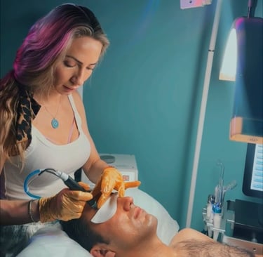 licensed esthetician performing Hydro facial in a beauty salon on a man client