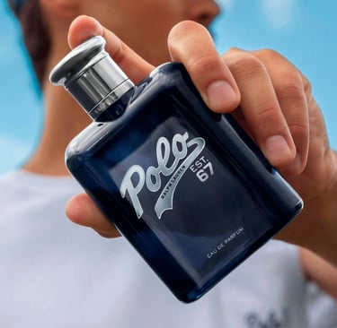 Hand holding a bottle of Ralph Lauren Polo Est. 67 Eau de Parfum men's fragrance.