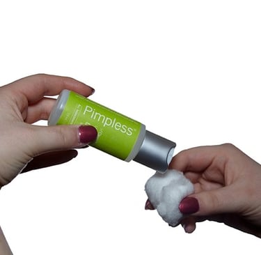 a person applying a solution on cotton balls