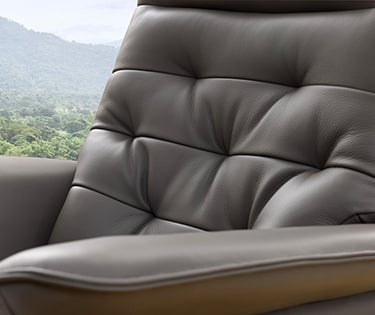 a chair with a view of a mountain in the background