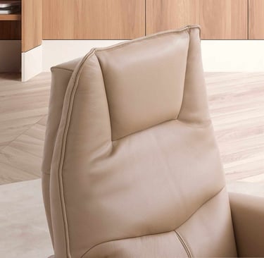 a chair with a bookcase and a book shelf