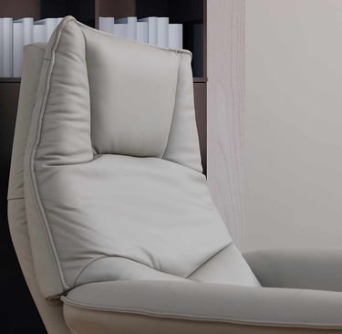 a chair with a book shelf and a bookcase