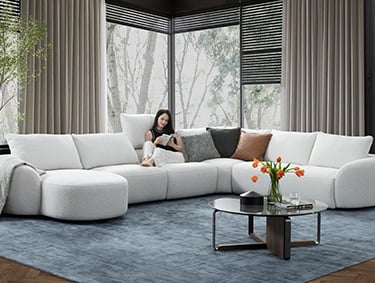 a woman sitting on a couch in a living room