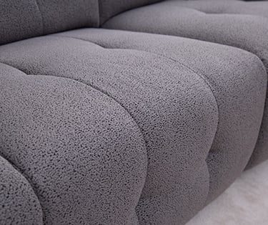 a couch with a cat sitting on top of it