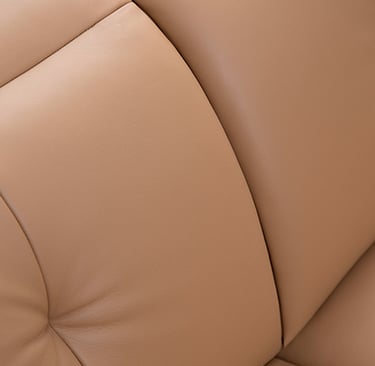 a couch with a brown leather couch and a white couch