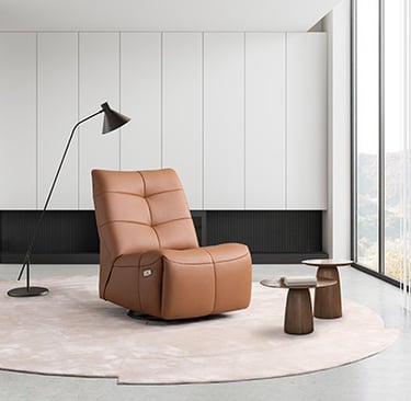 a living room with a chair and a lamp