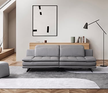 a living room with a couch and a chair