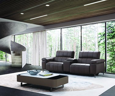 a living room with a spiral staircase going up to the top floor