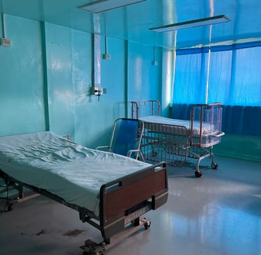 a Cuban hospital room with a bed and a hospital bed
