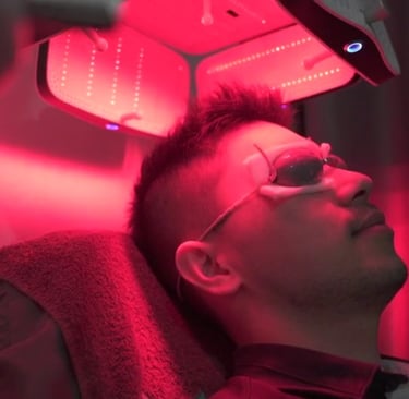 A picture of a man receiving LLLT therapy for hair loss