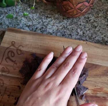 Iveth Balanta cutting cacao paste