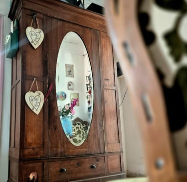 a mirror in a cabinet with hearts on it taken during a Cyprus tour