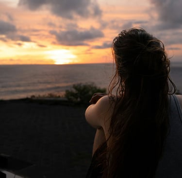 Young person reflecting on their future with a sense of calm and possibility.