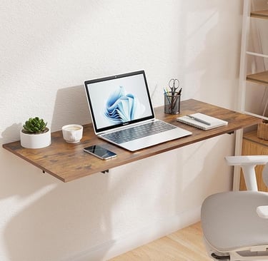 Wall-mounted folding desk with laptop and succulent in a small apartment home office — space-saving 
