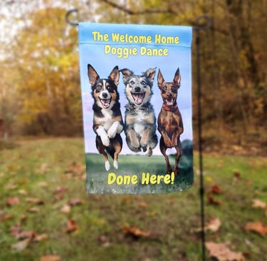 A garden flag picturing three happy dogs jumping and "the welcome home happy dance done here!".