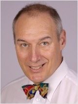 a man in a white shirt and a bow tie