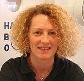 a woman with blonde hair and a black shirt