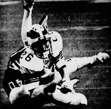 Terry Mahan tackles Matt Kendall during the 1980 Rivalry Game at the NAU Skydome.