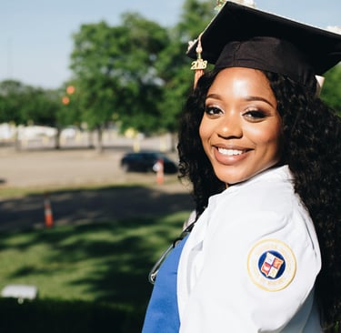 a woman in a graduation cap and gown