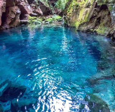 a river with a waterfall and a waterfall