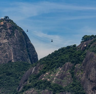 cable car going up a mountain with a cable car going up the mountain, Pão de Açucar, Rio de Janeiro