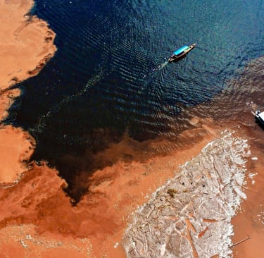 a boat is in the water near a beach