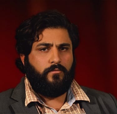 bearded man with red background