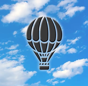 Hot Air Balloon Symbol on Blue Sky with Clouds