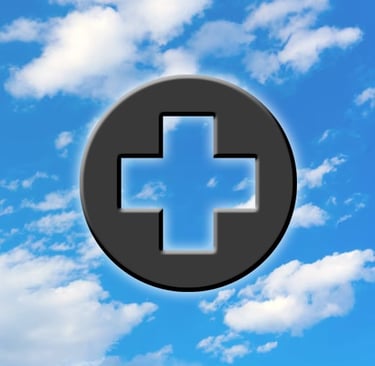 Medical Cross Symbol on Blue Sky with Clouds