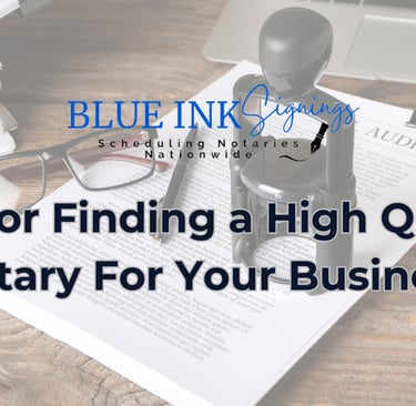 a desk with a pen and glasses on top of a desk with a laptop and