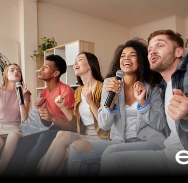 Group of friends enjoying a karaoke night with wireless microphones, rented from Echo Event Rentals