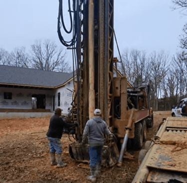 well drilling truck backs up