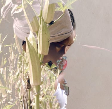 Close-up of a performer standing in tall grass – La distanza di sicurezza by Tina Bikic