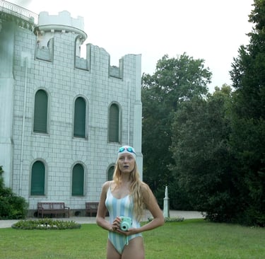 Woman standing in front of a white castle, scene from Nostalgia by Tina Bikic.