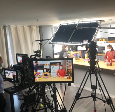 Kids cooking show set with professional lighting, cameras, and production monitors