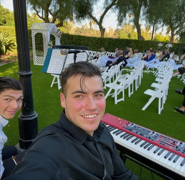 Pianist Daine Jordan and violinist Jude Dzama getting ready for a wedding gig