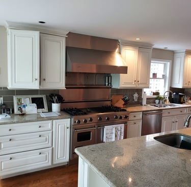 a kitchen with counter top and cabinets