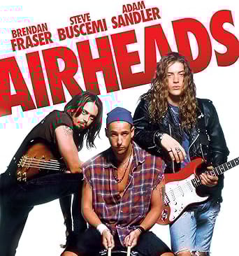 a group of people standing around a guitar