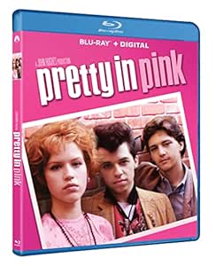 a pretty young woman in a pink dress and a man in a pink shirt