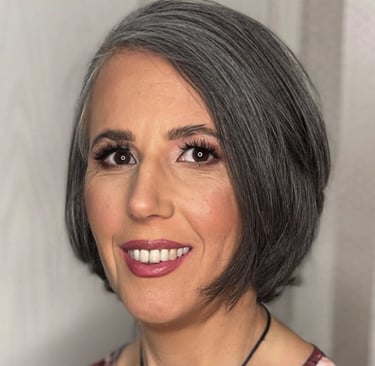 A headshot of Andrea Czabo Csilla