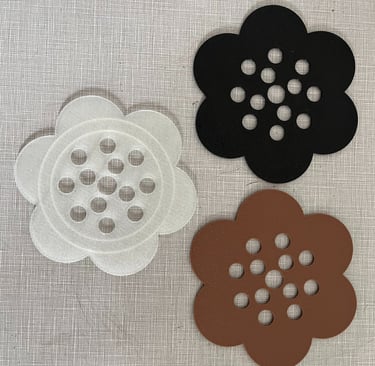a clear, black, and brown 3d printed flower frog