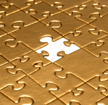gold puzzle with missing piece
