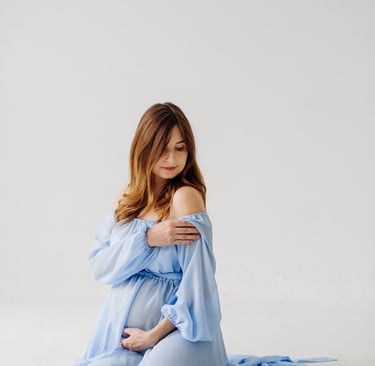 pregnant woman wearing blue background cleaning 