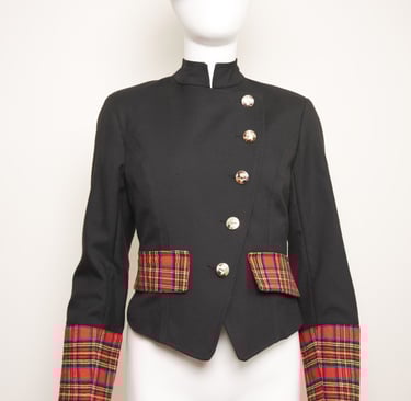 Tartan pocket flaps and cuffs on asymmetric  jacket  fastened in metal military buttons