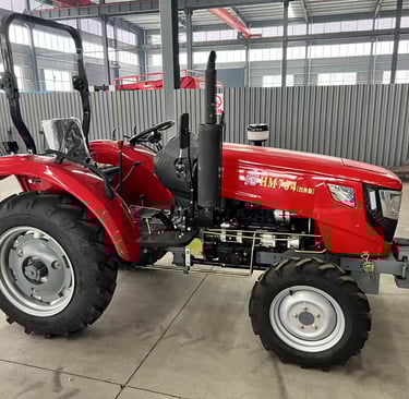 a red tractor with a large wheel on it